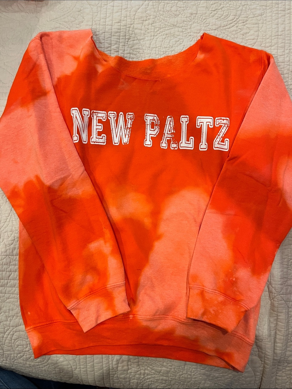 Orange tie dye women’s NEW PALTZ sweatshirt.